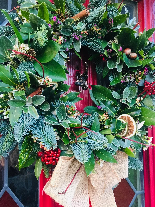 Florist choice wreath: Fresh, natural, traditional Christmas Front door wreath with dried oranges, pine cones and aromatic cinnamon sticks!