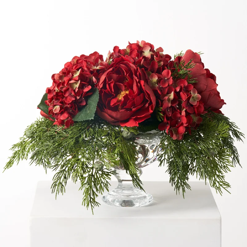 Holiday Jubilee - Real Touch Red Peony, Hydrangea & Cedar In Crystal Footed Urn Christmas Arrangement